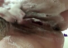Wife washing her tits and hairy pussy