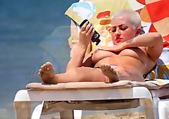 Bust pierced blonde filmed on beach